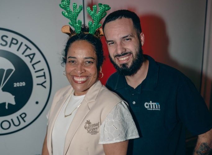 ATM crew member in a branded polo with a Coconut Grove Business Improvement District representative