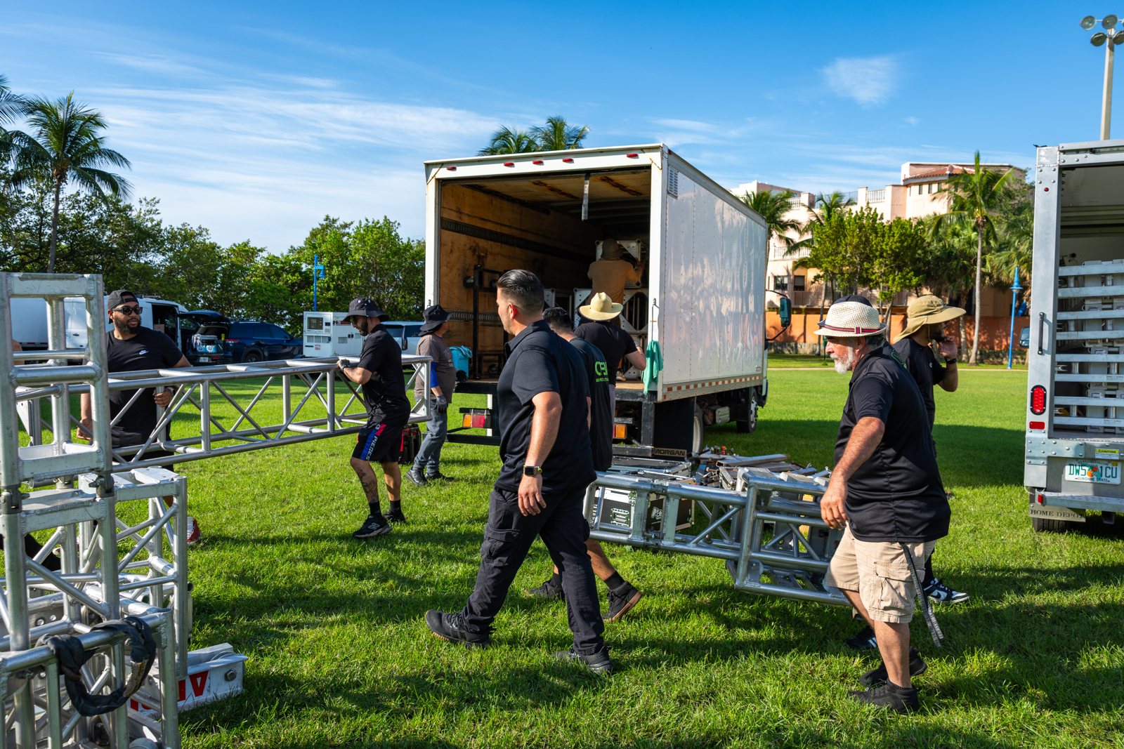 ATM crew unloading truss from the truck at the park build