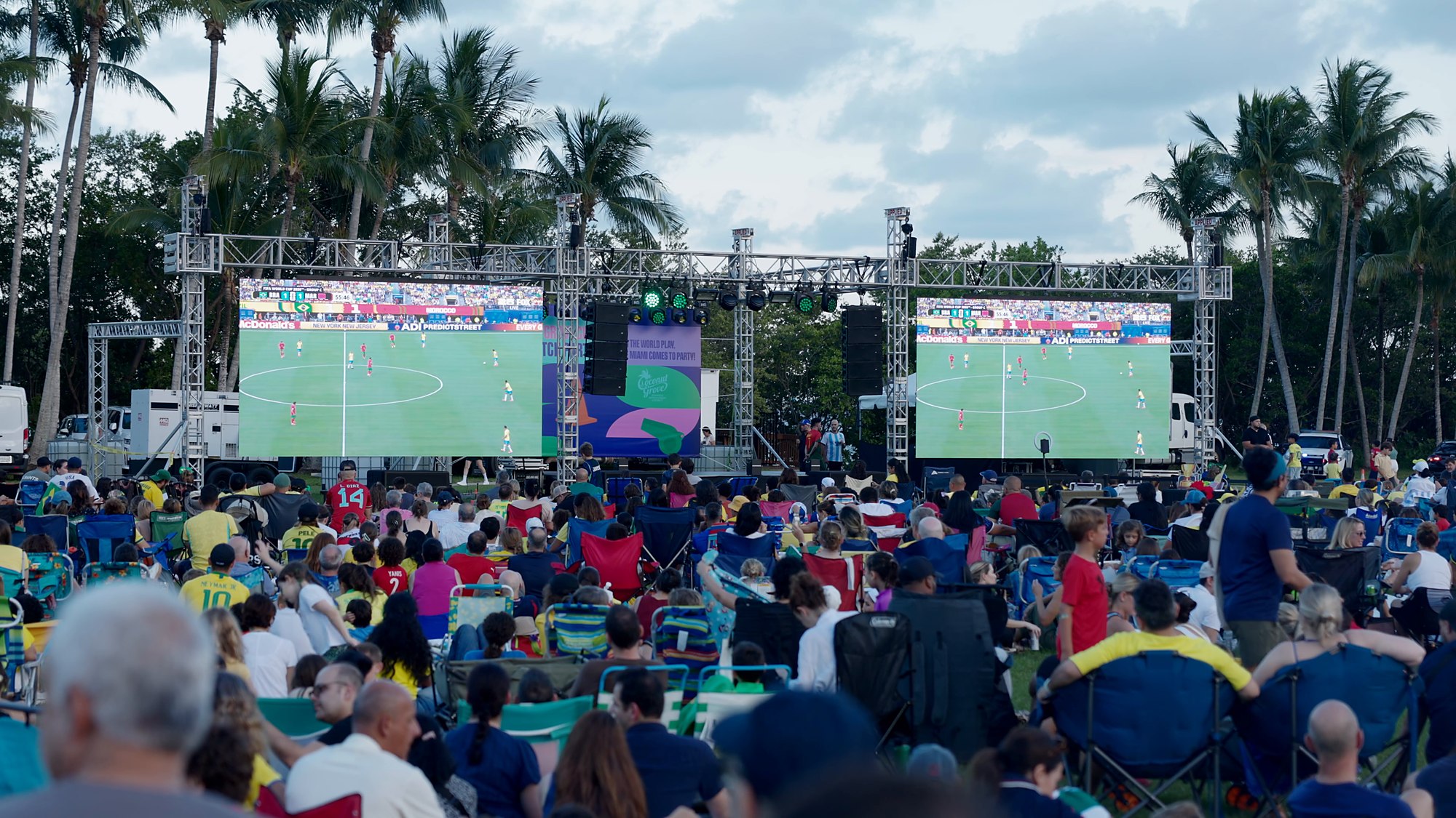 Two large LED walls and a full crowd at the FIFA World Cup watch party in Peacock Park