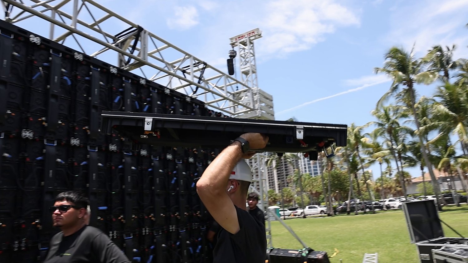 ATM crew chaining LED panels onto the truss structure